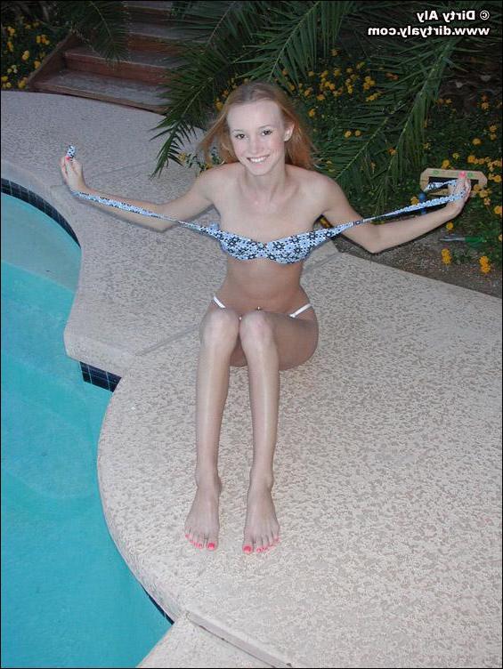 20P Pictures of teen Dirty Aly getting naked by the pool