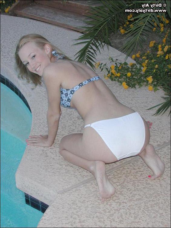 20P Pictures of teen Dirty Aly getting naked by the pool
