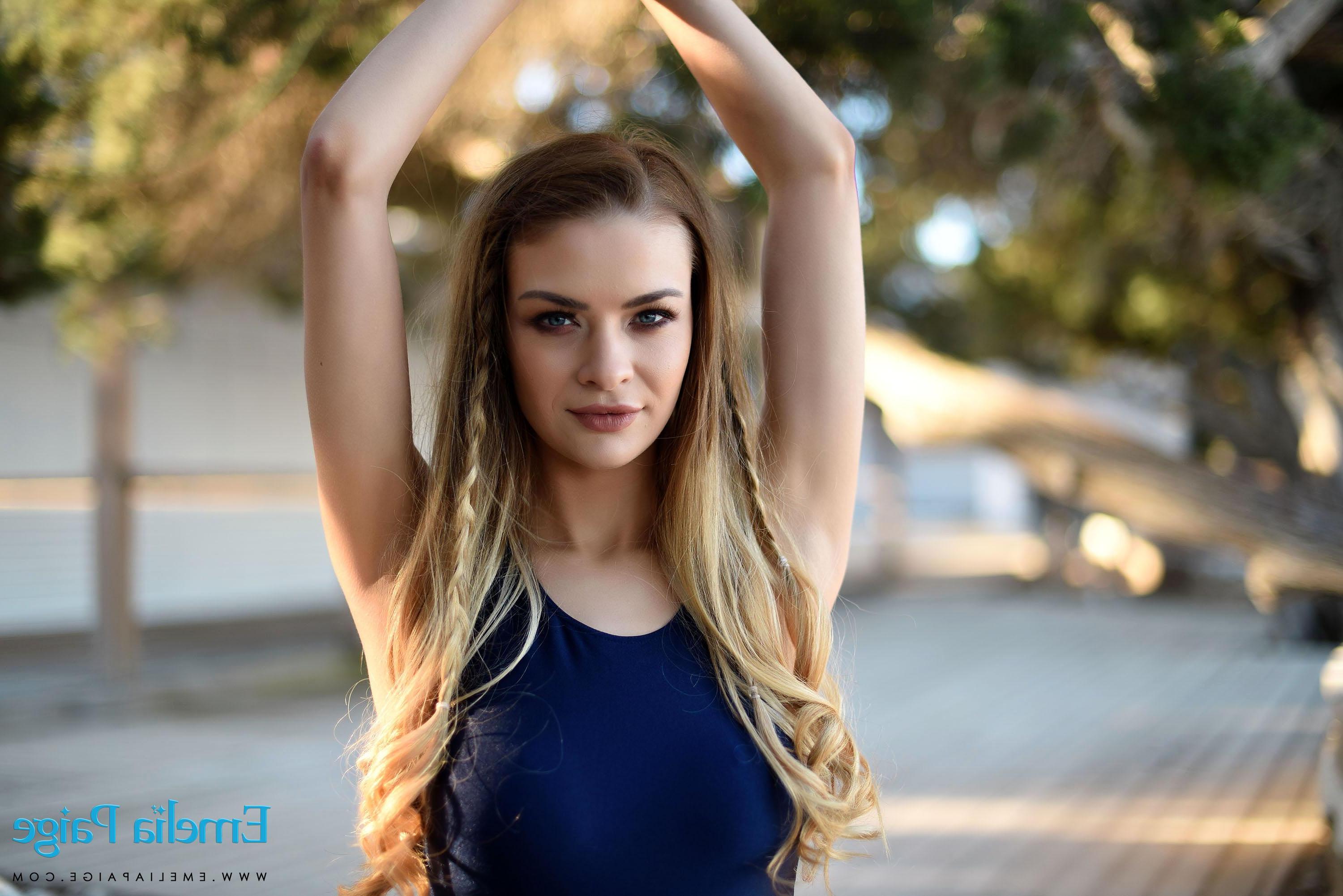 16P Beautiful girl Emelia strips and teases in her blue swimsuit outside