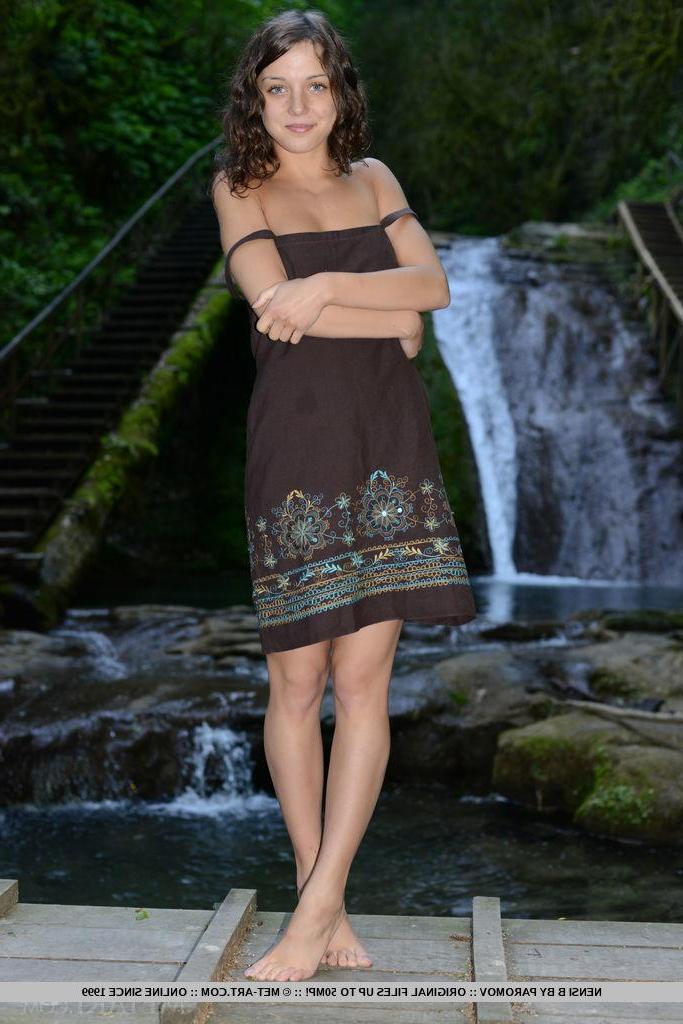 18P Beautiful brunette girl Foxy Di strips naked in a rain forest