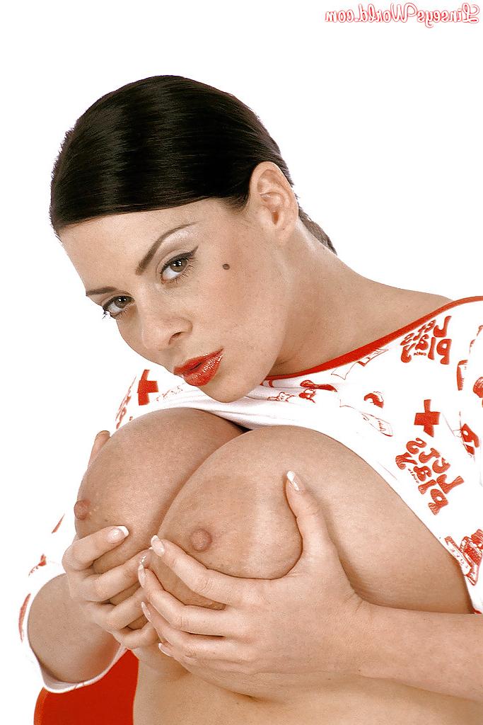 16P Big titted babe Linsey Dawn McKenzie posing on heels and playing with her cooter