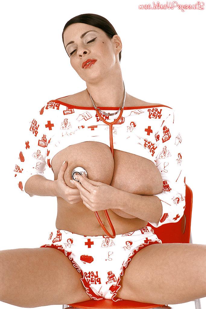16P Big titted babe Linsey Dawn McKenzie posing on heels and playing with her cooter