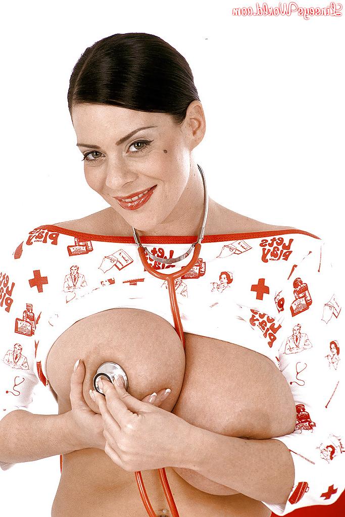 16P Big titted babe Linsey Dawn McKenzie posing on heels and playing with her cooter