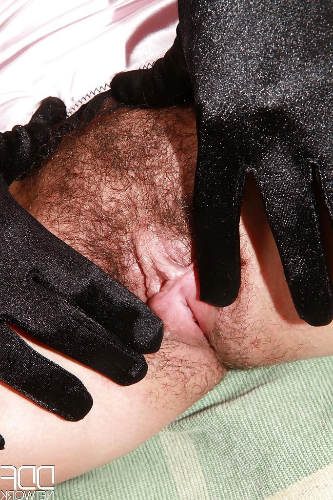 16P Solo model Simone slides panties aside to spread beaver with black gloves