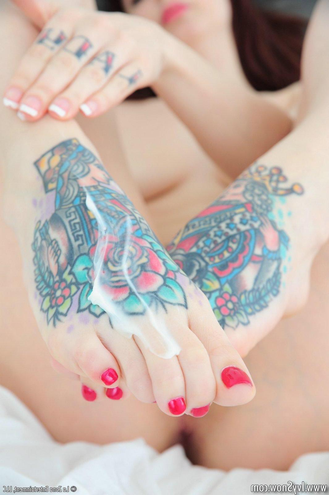 15P Ivy Snow shows off her pretty feet by rubbing them down and giving a foot job to a lucky dildo