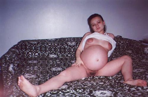 20P Little pregnant brunette on her bed