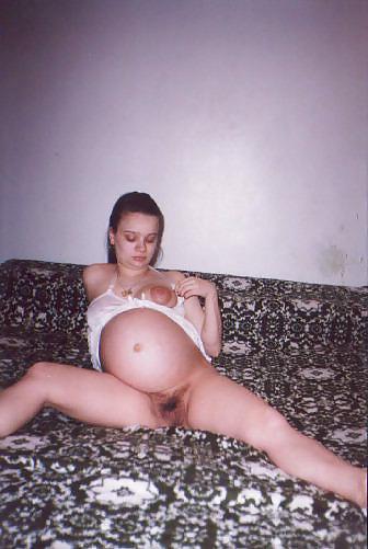 20P Little pregnant brunette on her bed