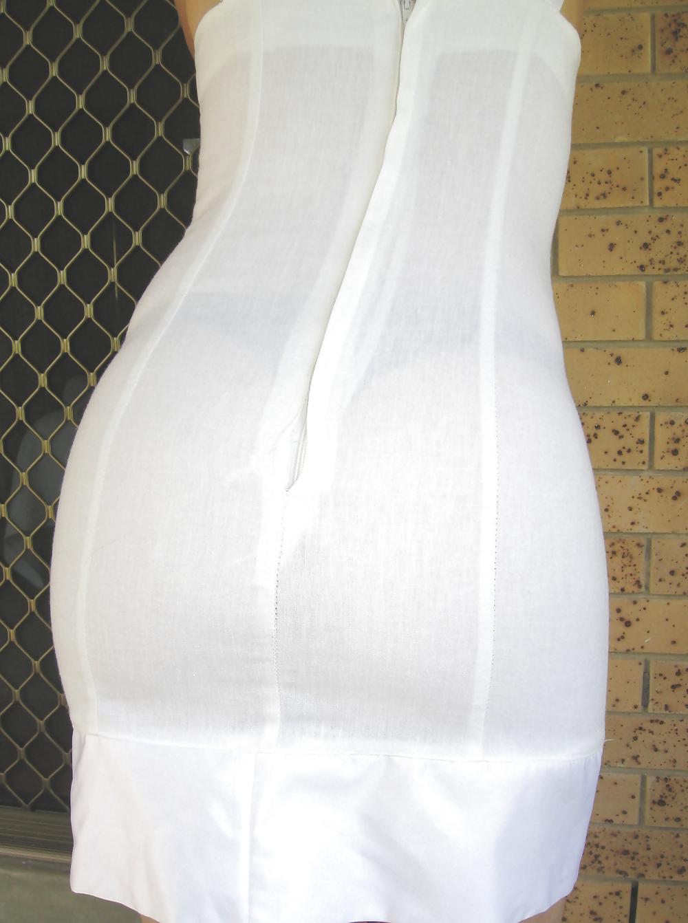 25P Upskirts of my redhead wife in her tight white dress