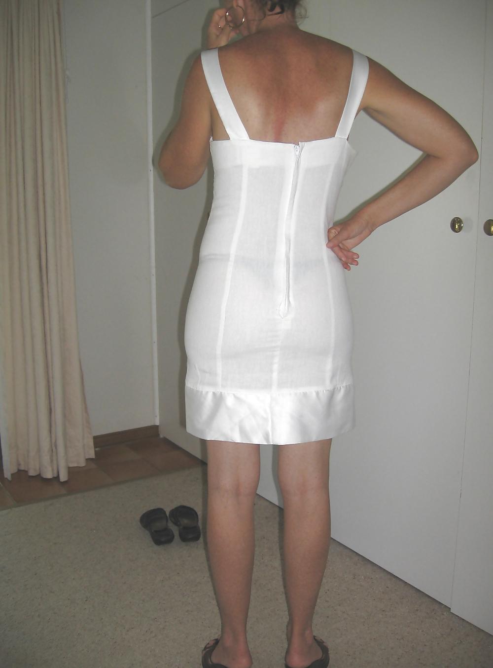 25P Upskirts of my redhead wife in her tight white dress
