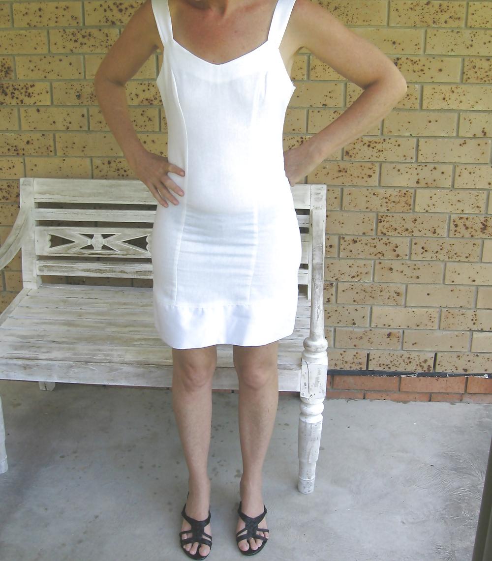 25P Upskirts of my redhead wife in her tight white dress
