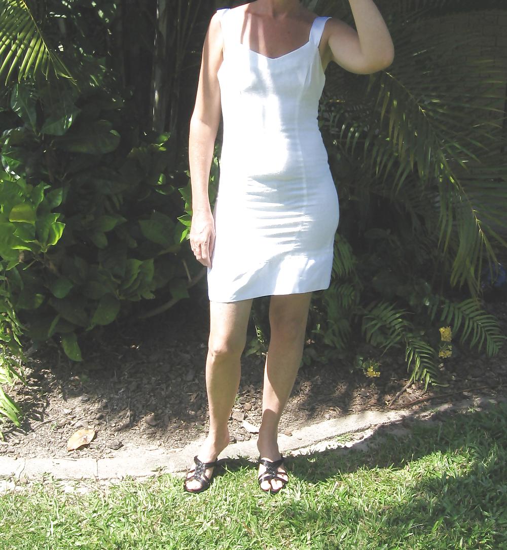 25P Upskirts of my redhead wife in her tight white dress
