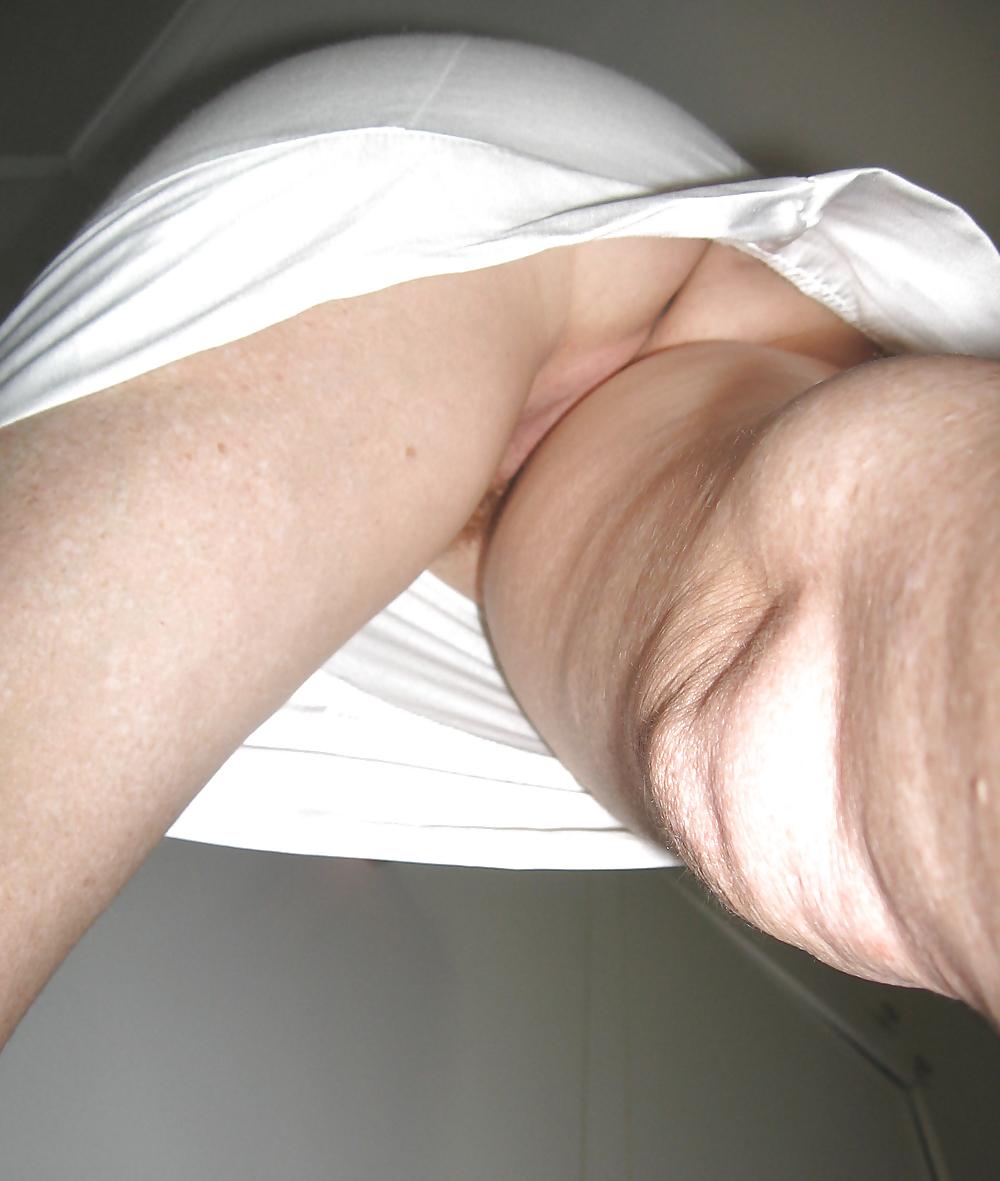 25P Upskirts of my redhead wife in her tight white dress
