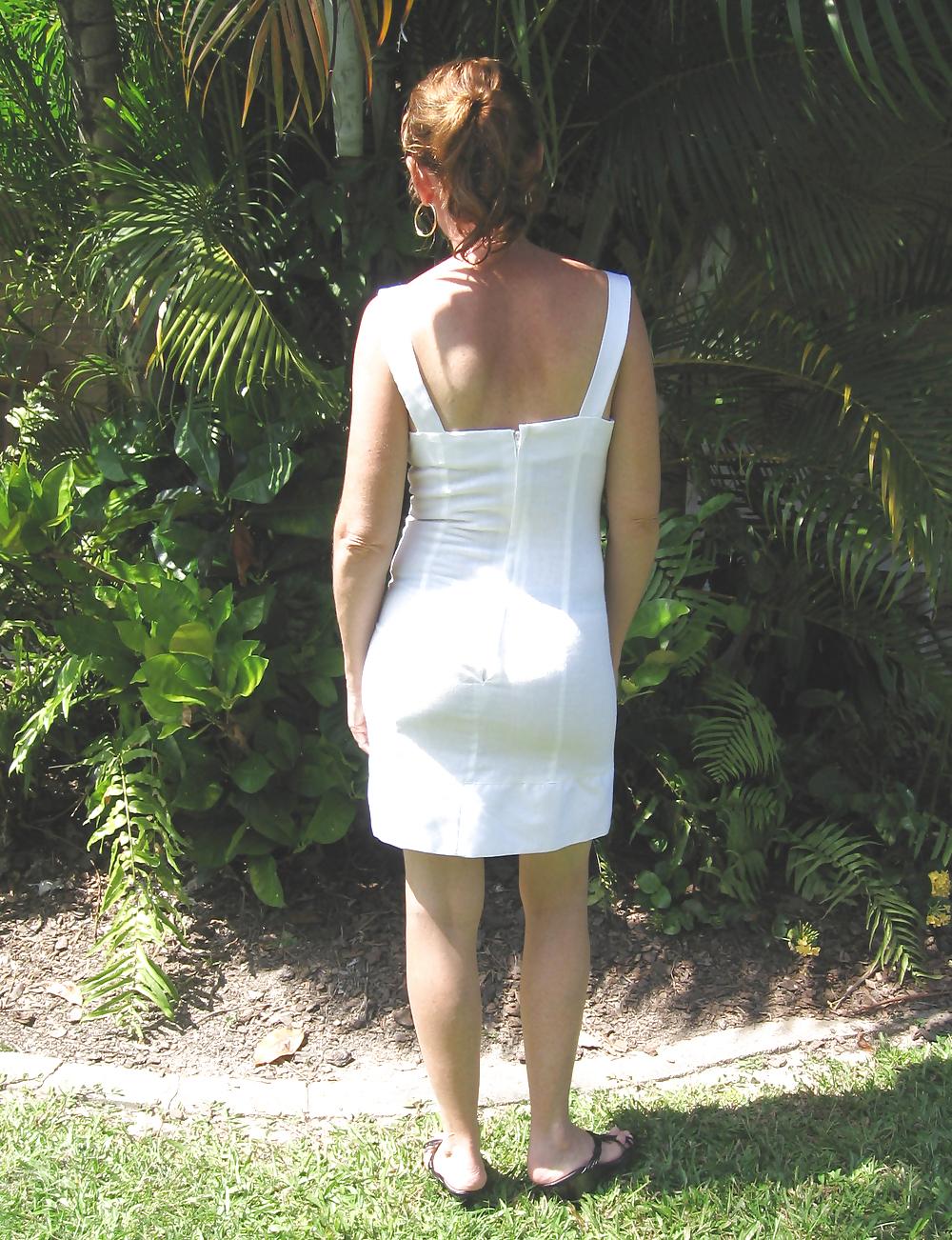 25P Upskirts of my redhead wife in her tight white dress