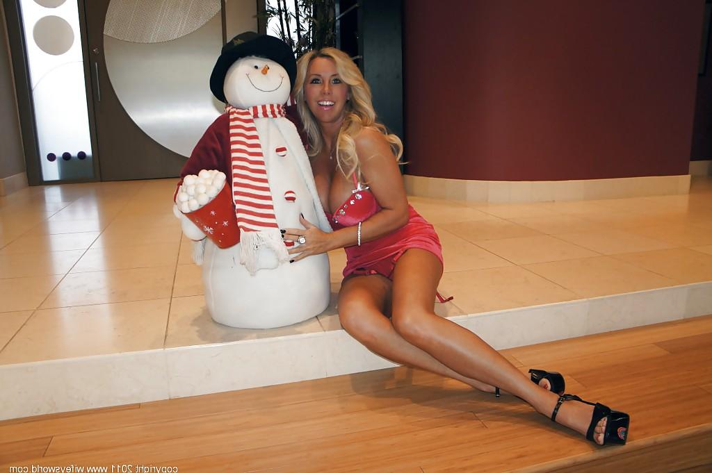 16P Stupendous mature blonde on high heels showcasing her huge knockers