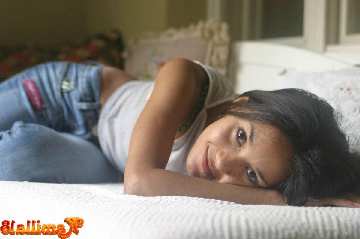 15P Kamilla taking off her jeans on bed