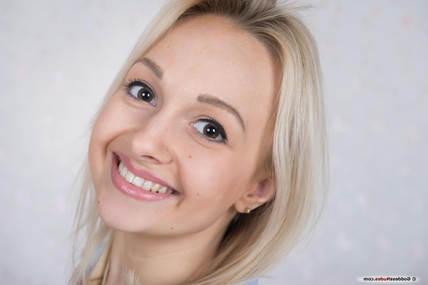 16P Iralin poses in front of the camera, showing her innocent face, and youthful body