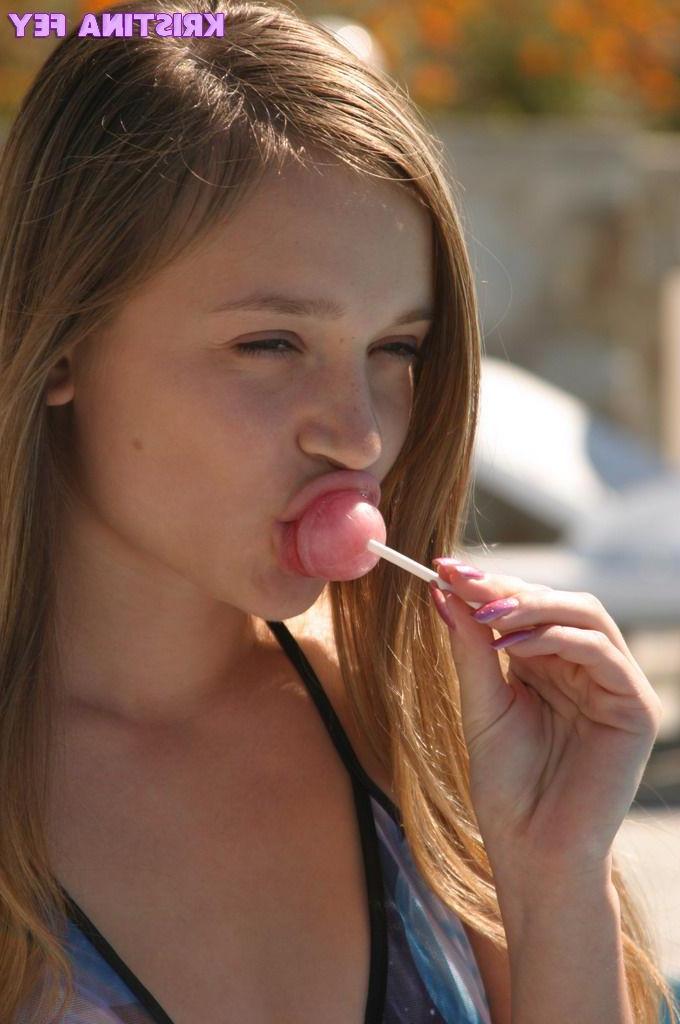 15P Pics of teen babe Kristina Fey doing naughty things to a lollipop