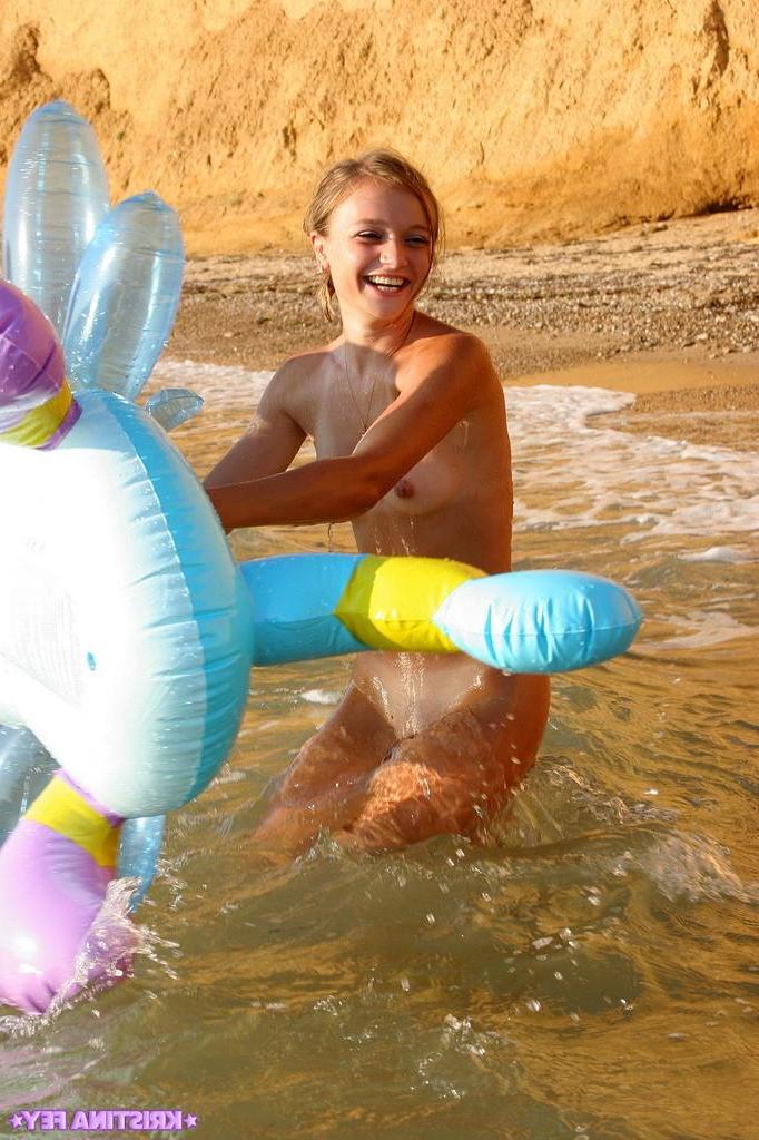 15P Pictures of Kristina Fey having some naked fun on the beach