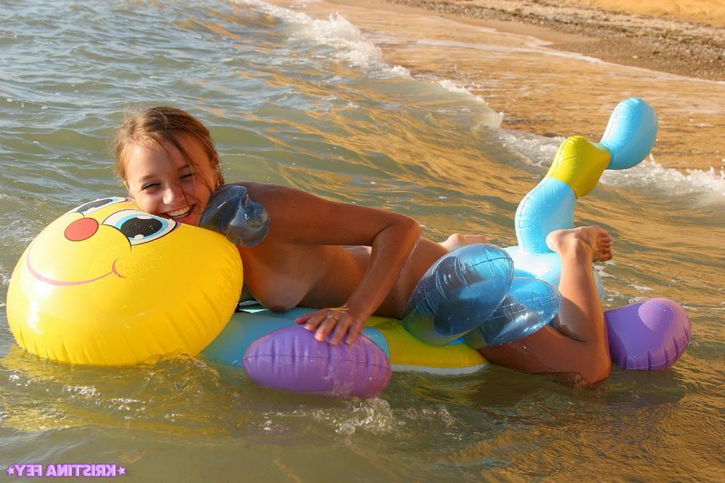 15P Pictures of Kristina Fey having some naked fun on the beach