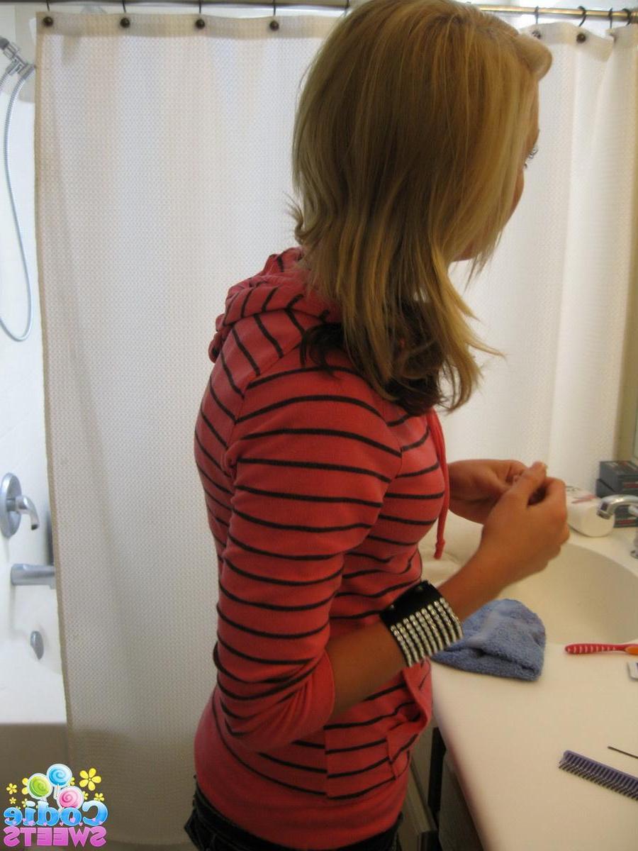 12P Cute blonde teen Codie Sweets shows off her perfect ass in tight jeans as she gets ready to shoot