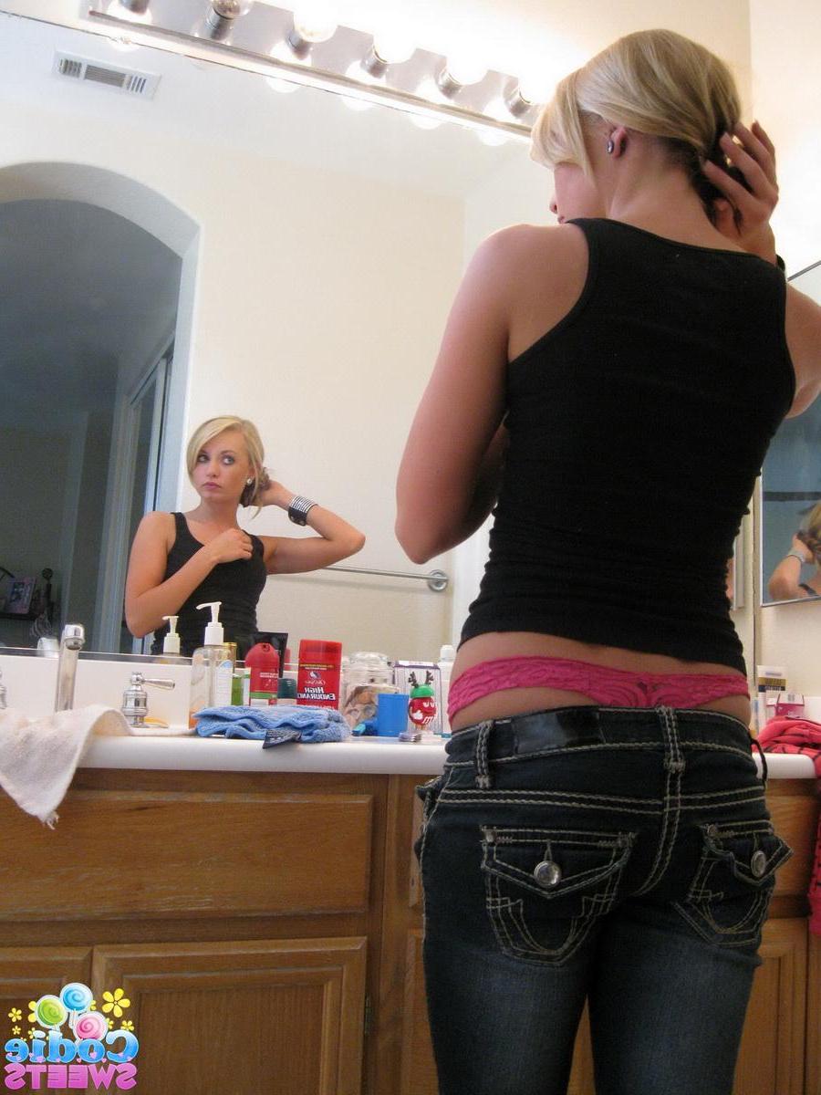 12P Cute blonde teen Codie Sweets shows off her perfect ass in tight jeans as she gets ready to shoot