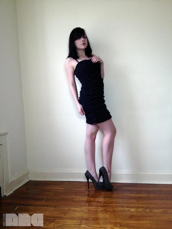 15P Sexy pinup Lilly Rose poses her hot body by the wall