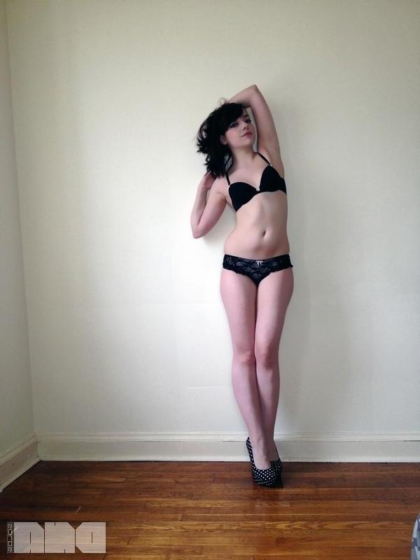 15P Sexy pinup Lilly Rose poses her hot body by the wall