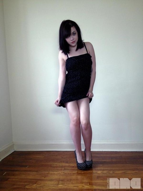 15P Sexy pinup Lilly Rose poses her hot body by the wall
