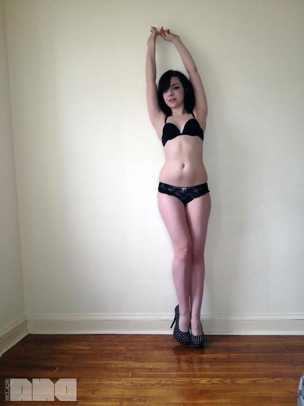 15P Sexy pinup Lilly Rose poses her hot body by the wall