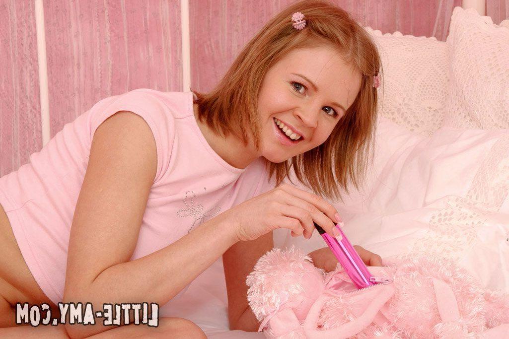 14P Pictures of Little Amy pleasuring her pussy with a vibrator
