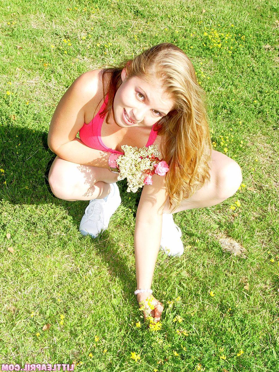 19P Pictures of Little April showing her tits and pussy in the park