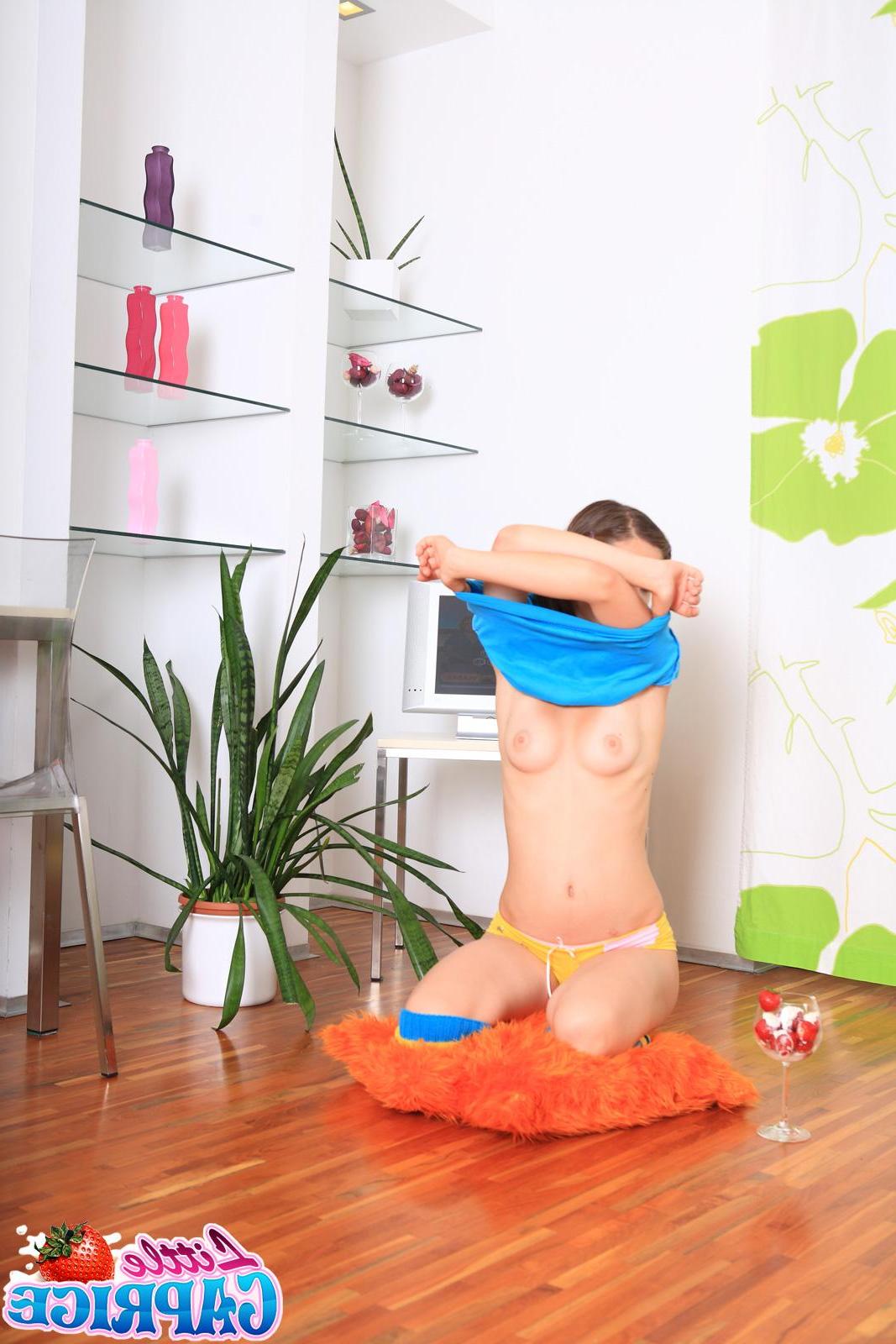20P Pictures of Little Caprice wearing pigtails and leg warmers