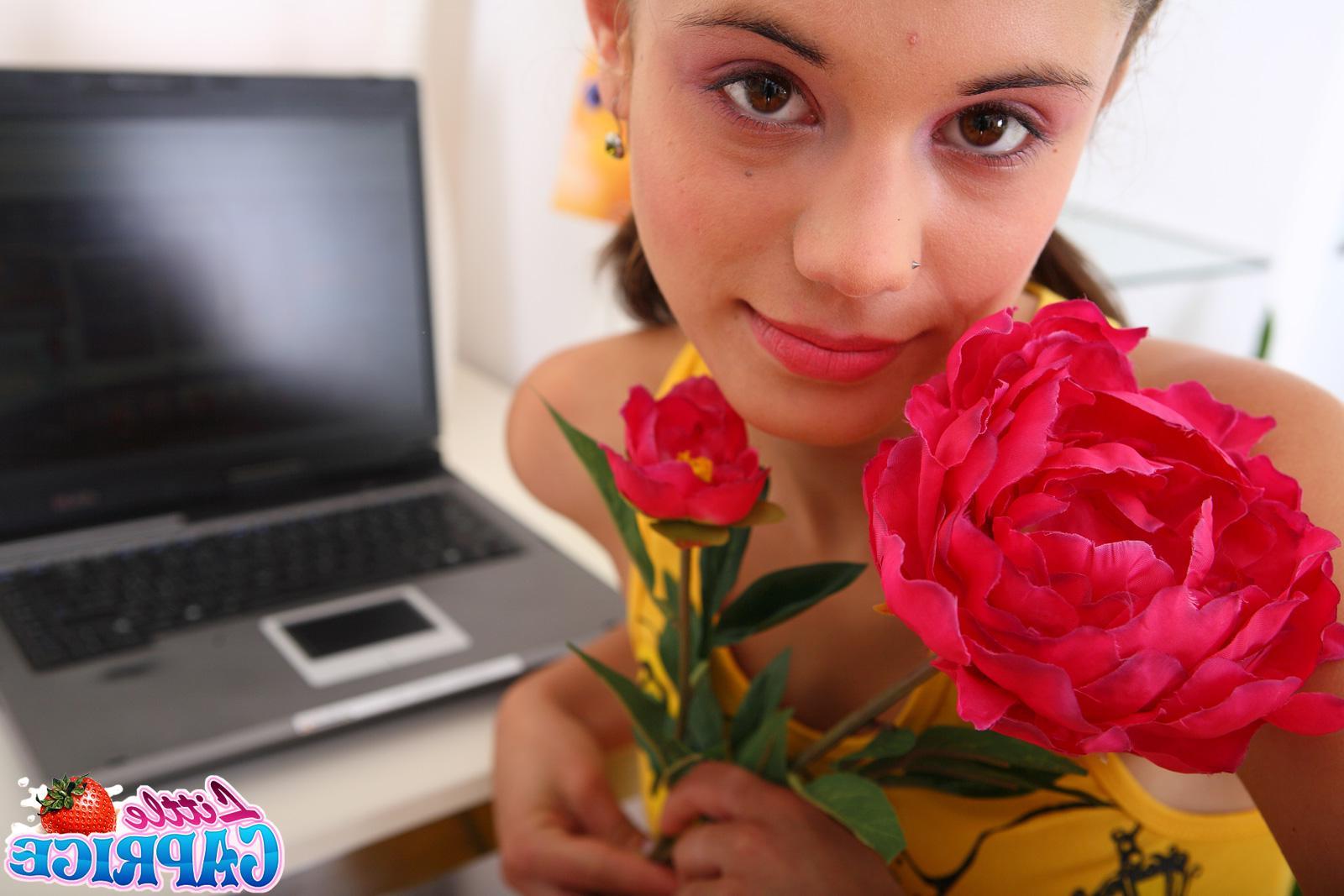 20P Pictures of Little Caprice getting naked at her computer