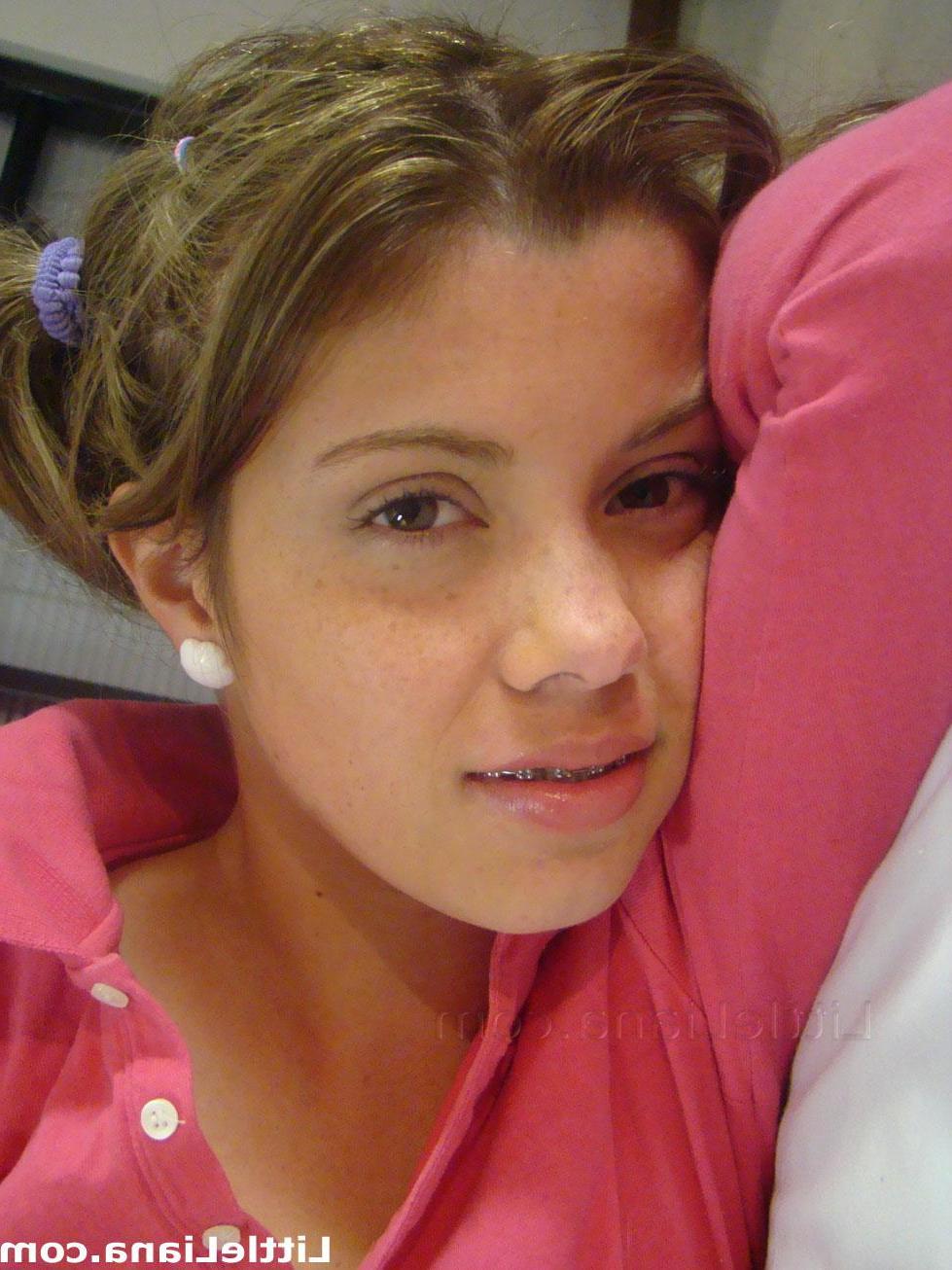 12P Little Liana puts on her purple socks and exposes her tits in bed