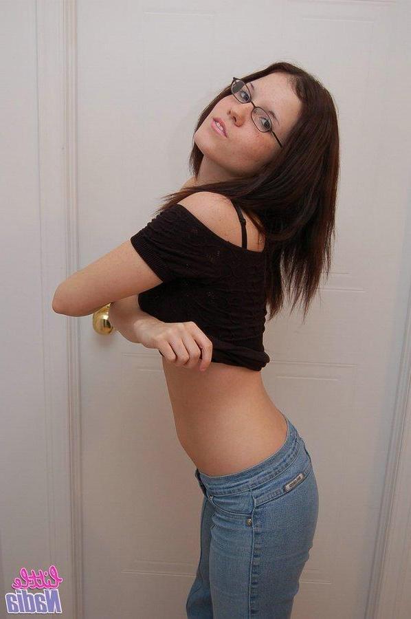 15P Pictures of teen hottie Little Nadia stripping down to her panties
