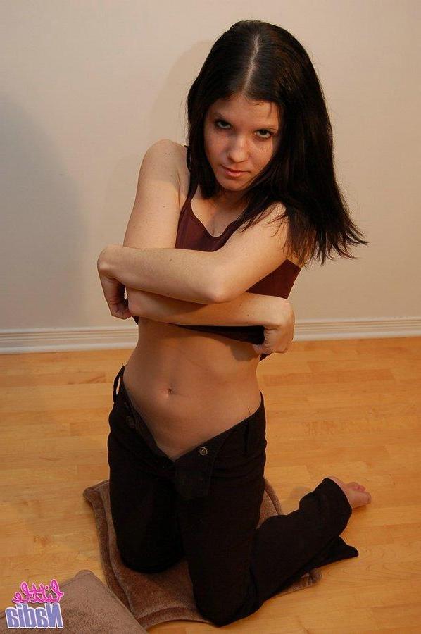 15P Pictures of teen model Little Nadia stripping naked for you