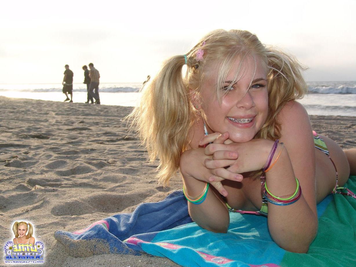 12P Pictures of hot blonde teen Little Summer having some fun on the beach