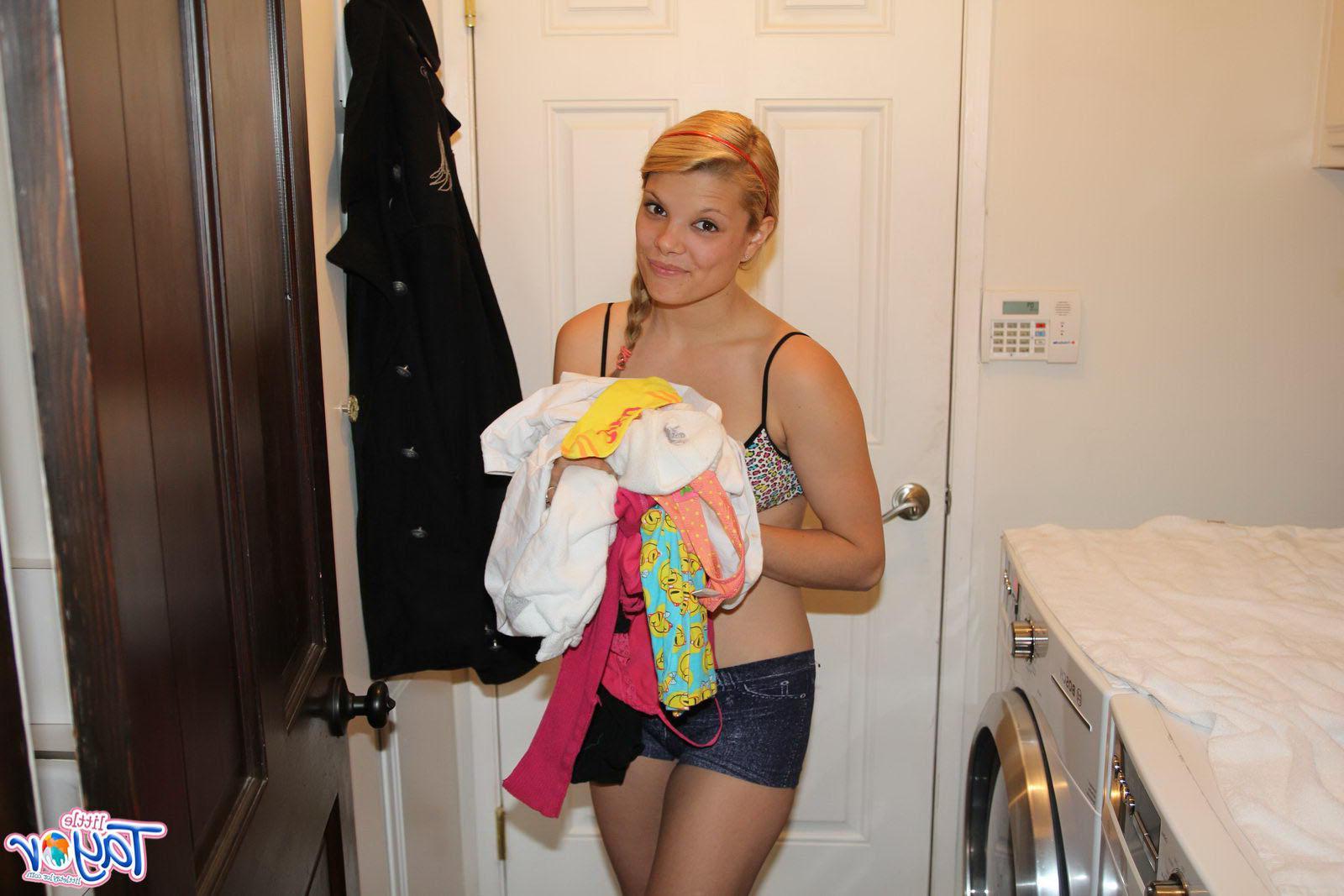 12P Pictures of blonde teen Little Taylor taking her clothes off to wash them