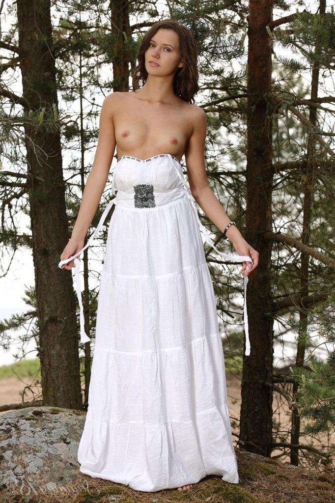 16P Brunette girl Lucy G strips nude in the forest