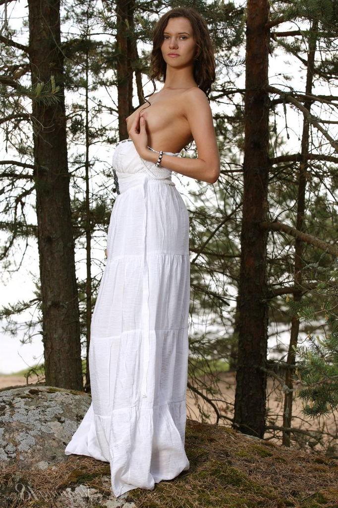 16P Brunette girl Lucy G strips nude in the forest