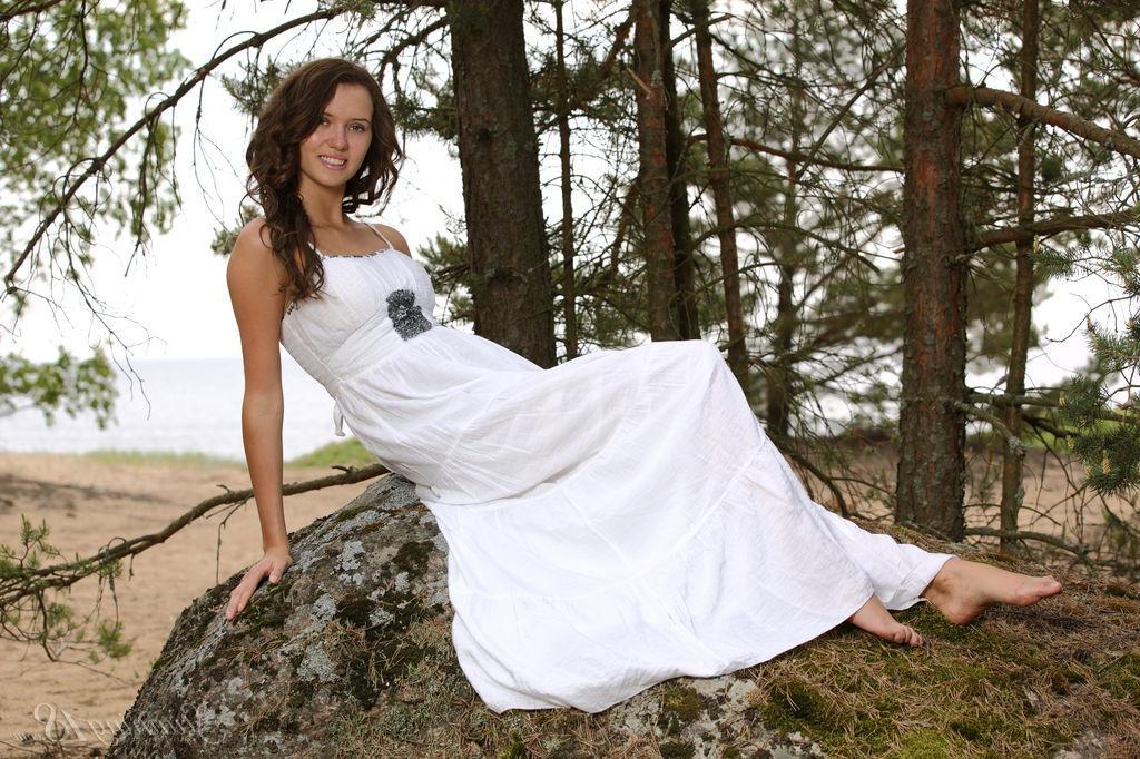 16P Brunette girl Lucy G strips nude in the forest