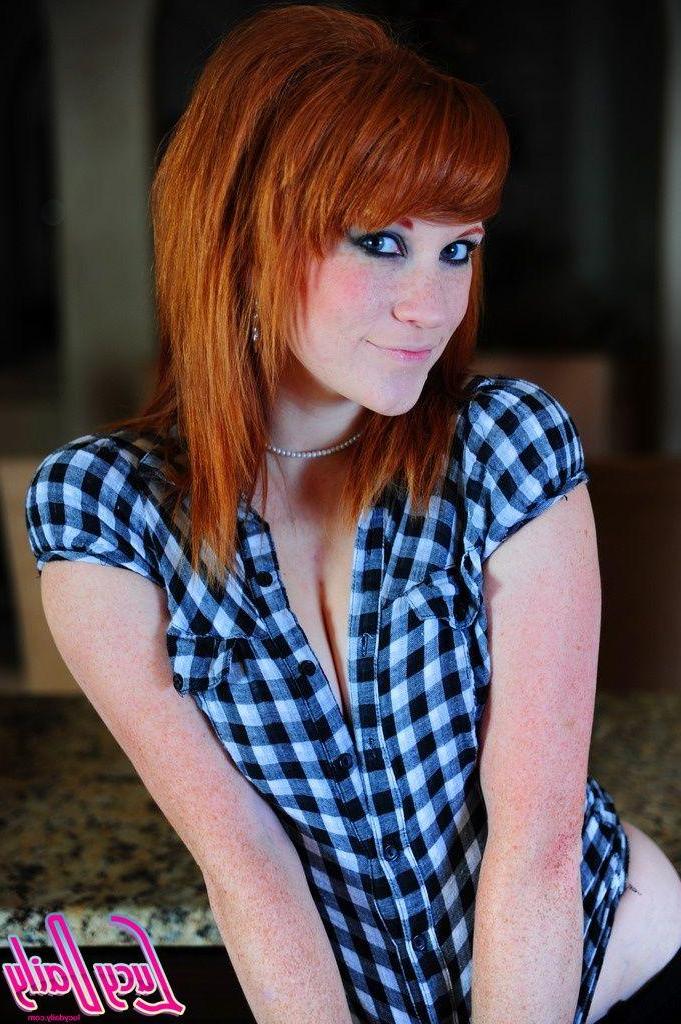 20P Pictures of Lucy Daily stripping out of her sexy plaid shirt