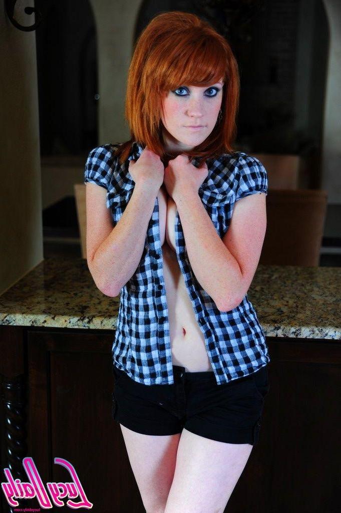 20P Pictures of Lucy Daily stripping out of her sexy plaid shirt