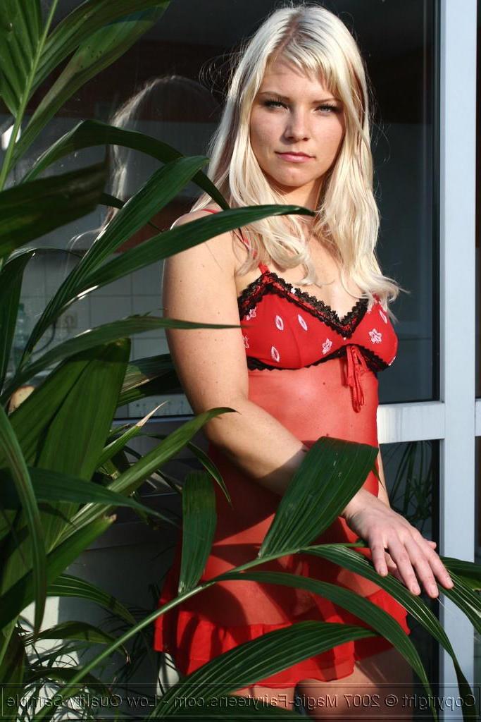 16P Pictures of Magic Laura teasing in a red dress