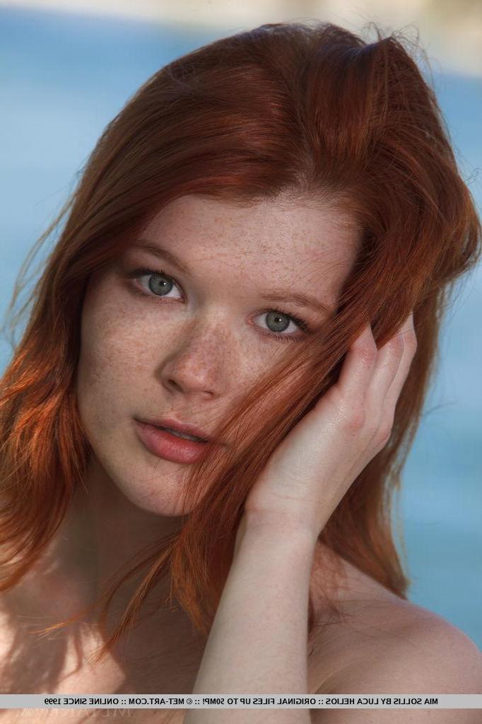 18P Stunning redhead Mia Sollis plays naked by the river