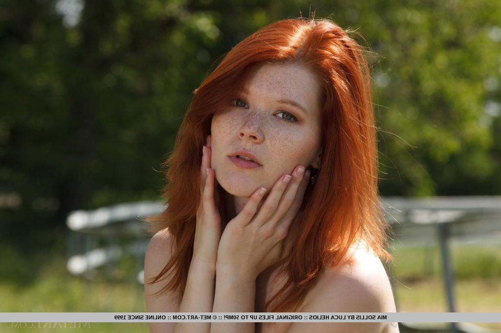 18P Redhead teen Mia Sollis shows you her tight pussy outside