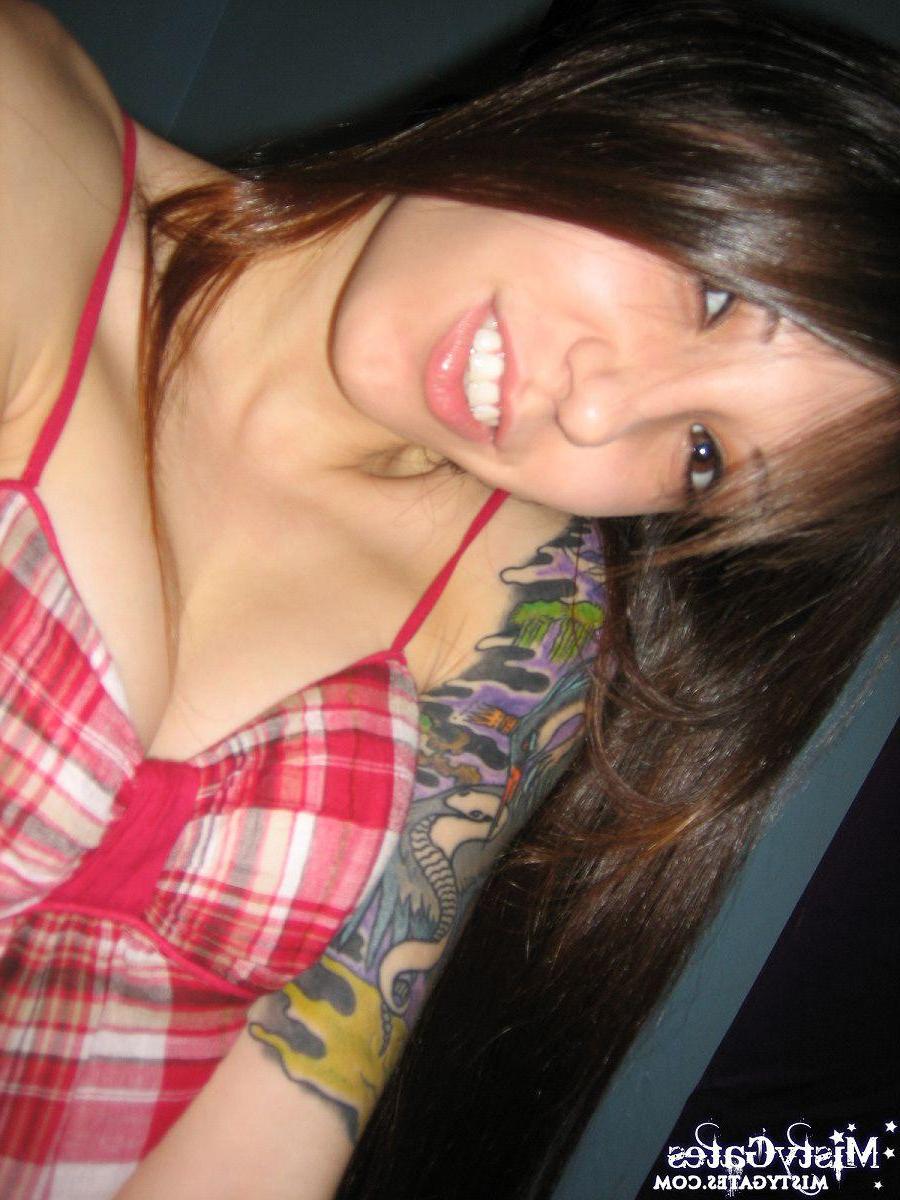20P Pictures of teen babe Misty Gates stripping out of her plaid dress