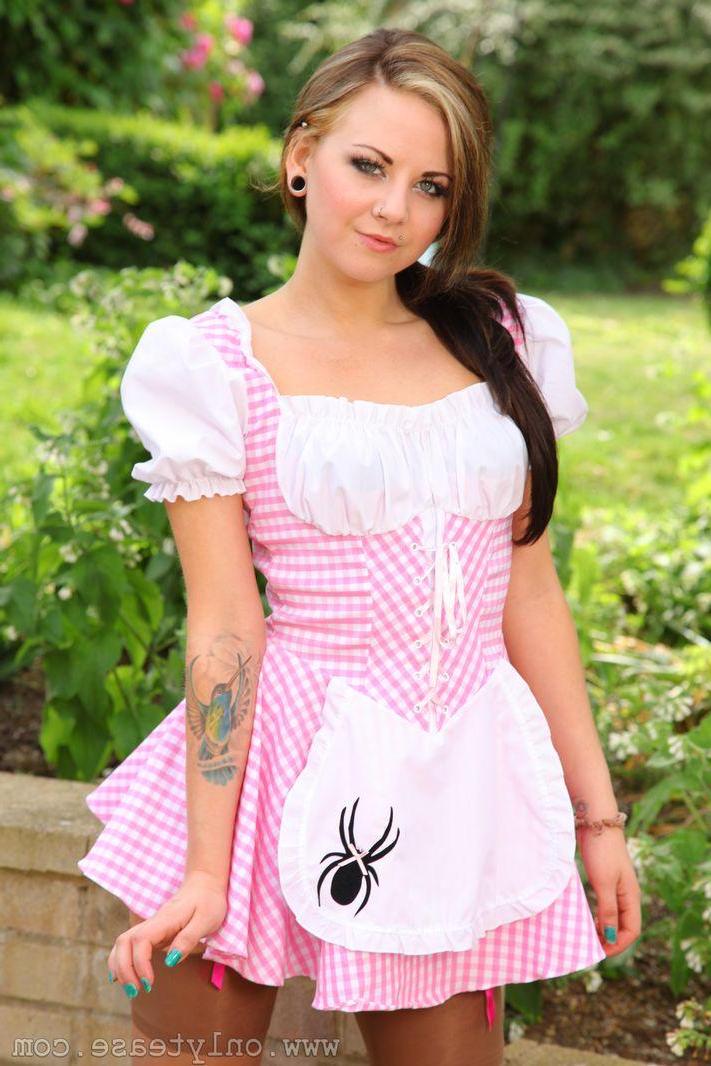 16P Sexy Miss Muffet outdoors in tan stockings.