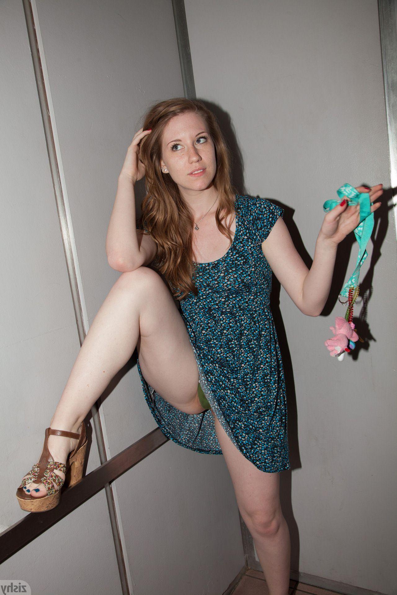 12P Beautiful girl Olivia Pelton shows off her sexy legs and round ass