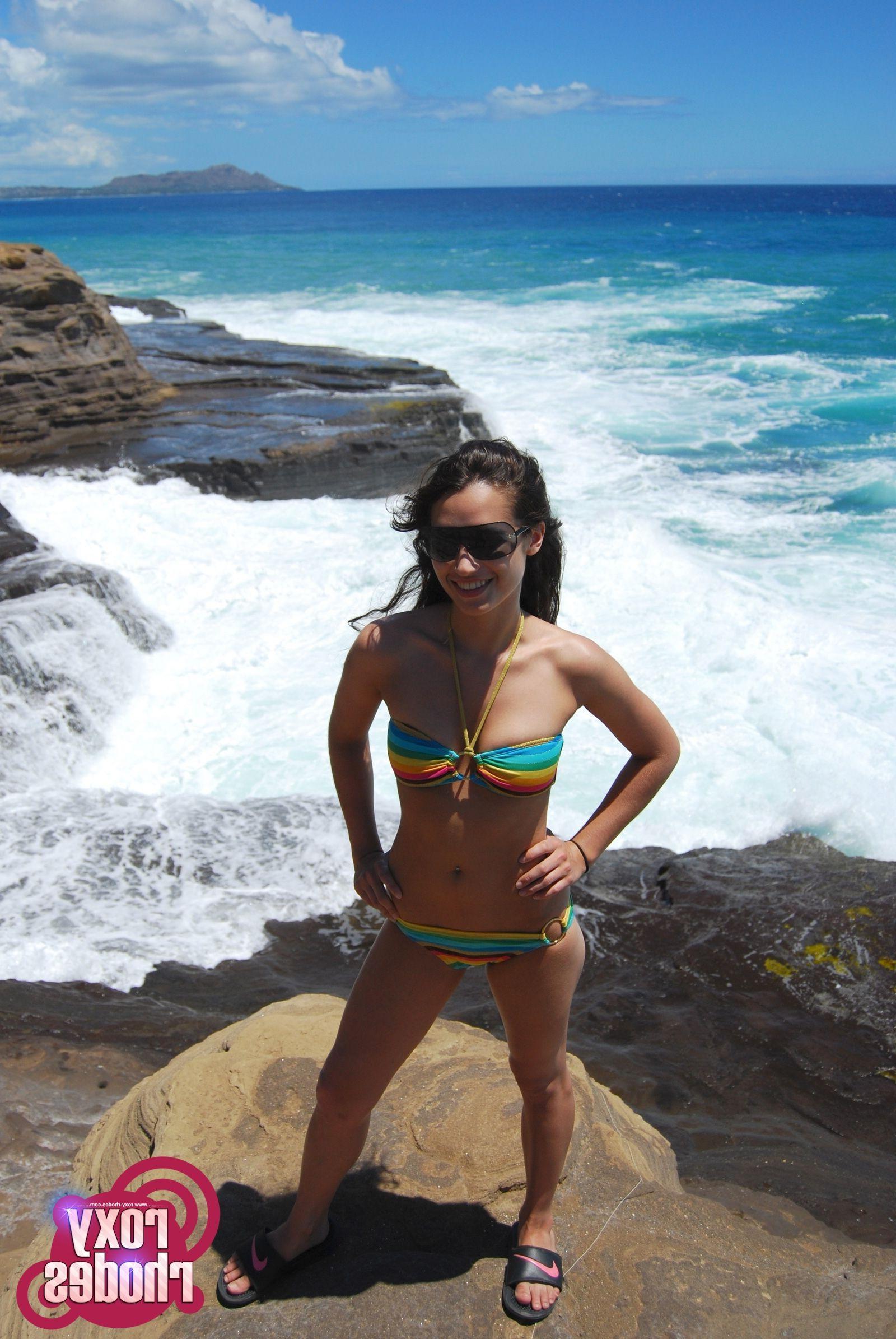 15P Pictures of Roxy Rhodes exposing her nude teen body on a beach